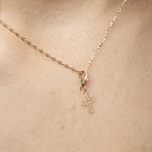 Yellow gold cross-shaped charm pendant
