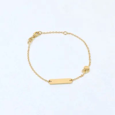 Yellow gold baby bracelet with tag and heart