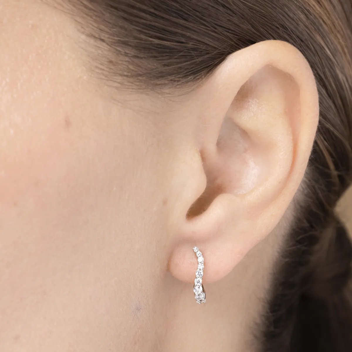 White gold one line earrings with cubic zirconia