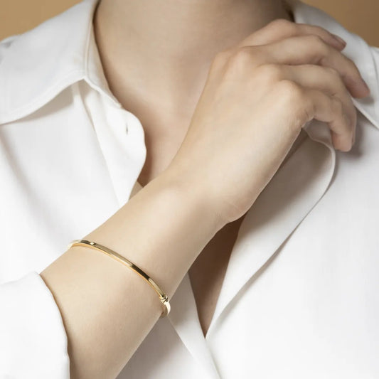 Yellow gold squared tube bangle bracelet