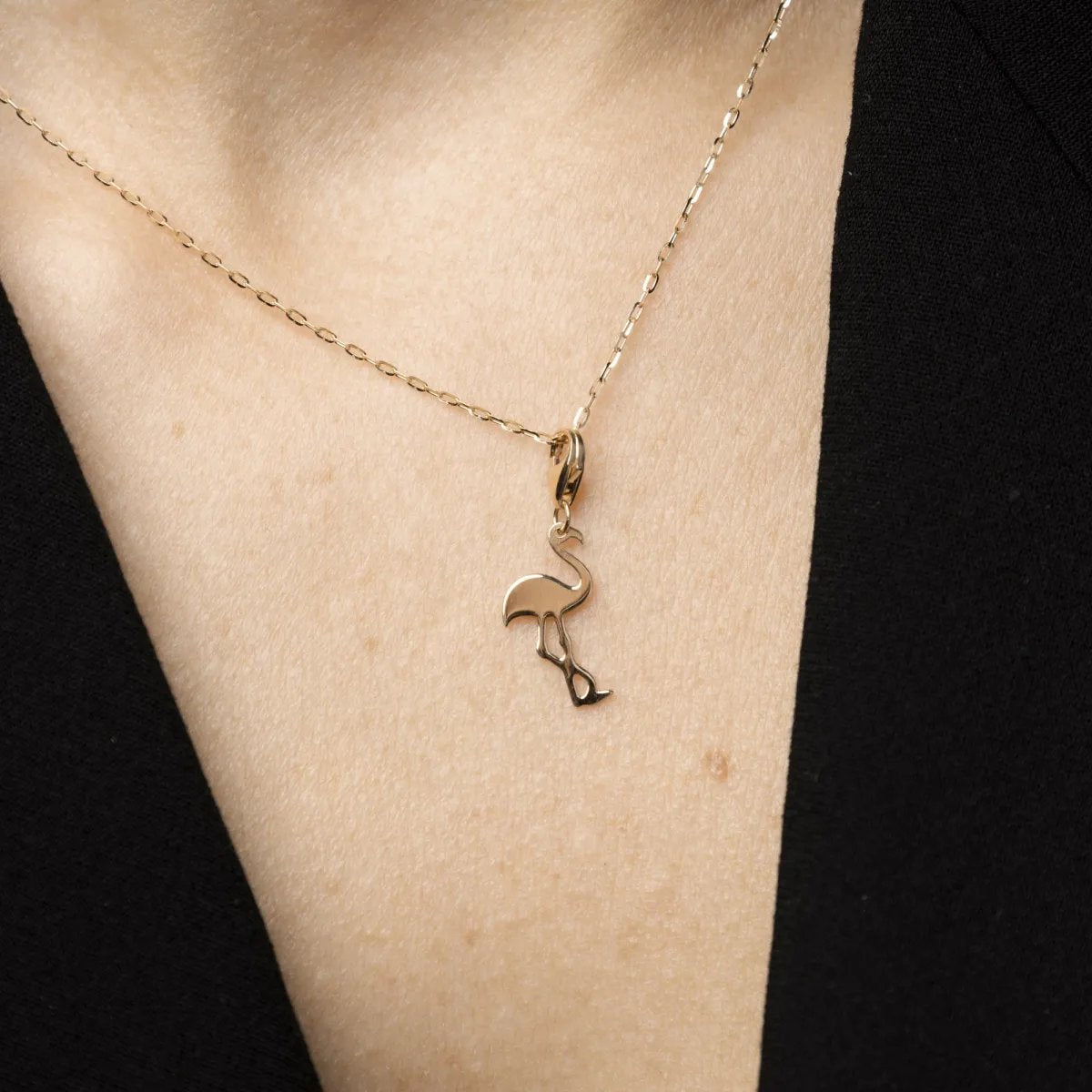 Yellow gold flamingo-shaped charm pendant