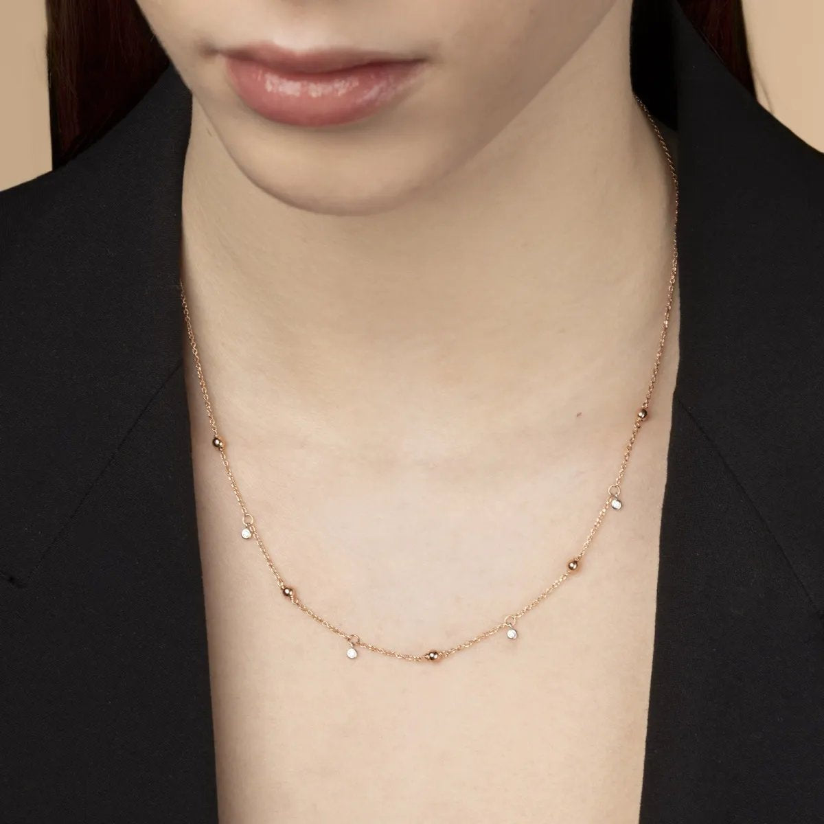 Rose gold necklace with spheres and cubic zirconia