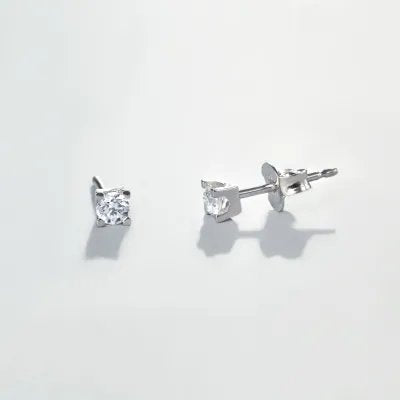 "Punto luce" earrings in white gold with zirconia