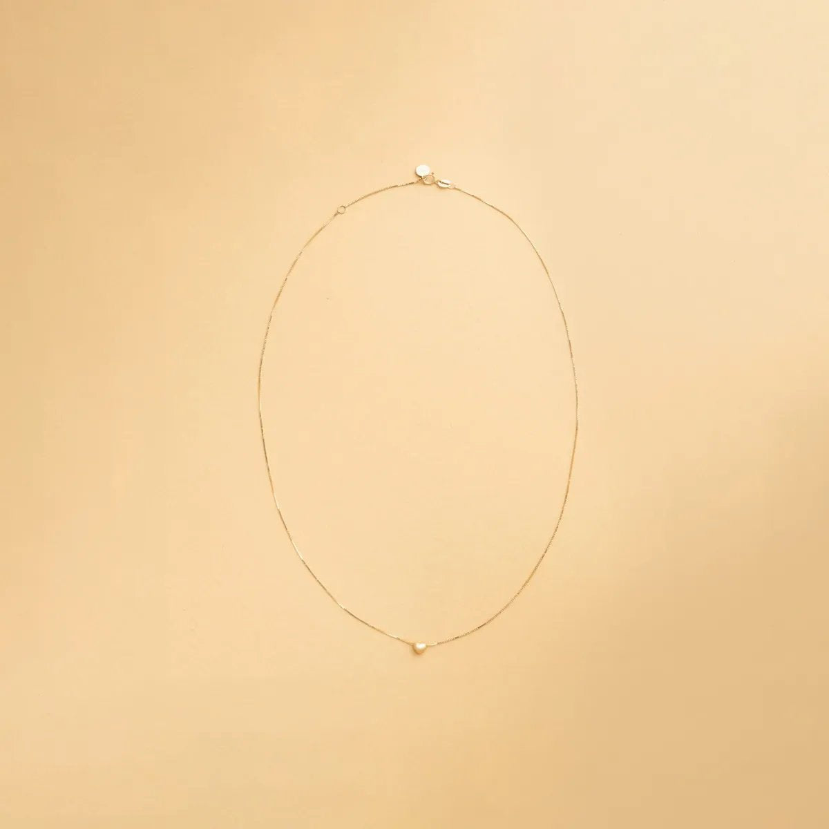 Yellow gold heart-shaped necklace