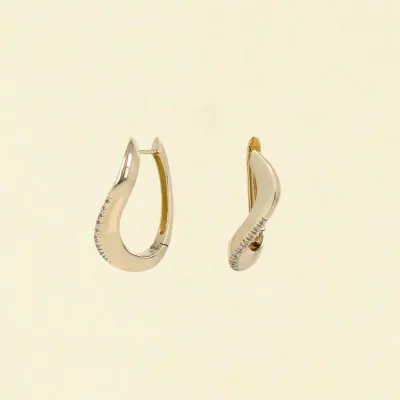 Fluid-shaped earrings in yellow gold with zirconia