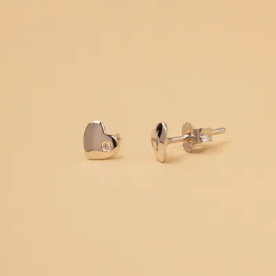 White gold heart-shaped earrings with cubic zirconia