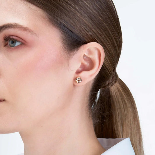"Knot" earrings in yellow and white gold