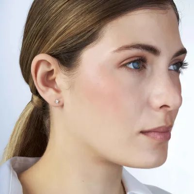 "Punto luce" earrings in yellow gold with zirconia