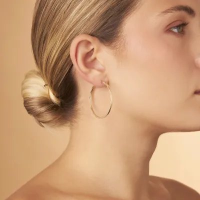 Yellow gold flex tube earrings 40 mm diamond cut