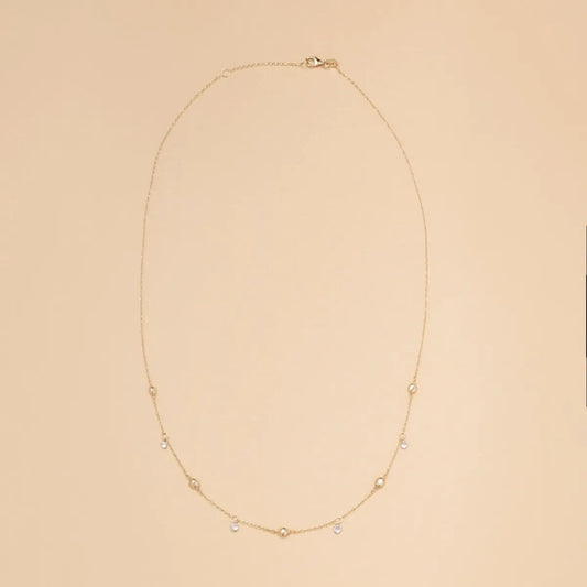 Yellow gold necklace with spheres and cubic zirconia