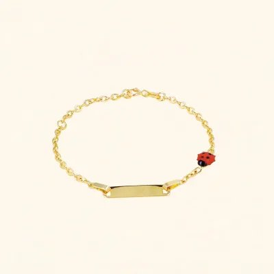 Yellow gold tag bracelet with enameled ladybug
