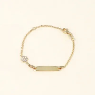 Yellow gold bracelet with flower and zirconia