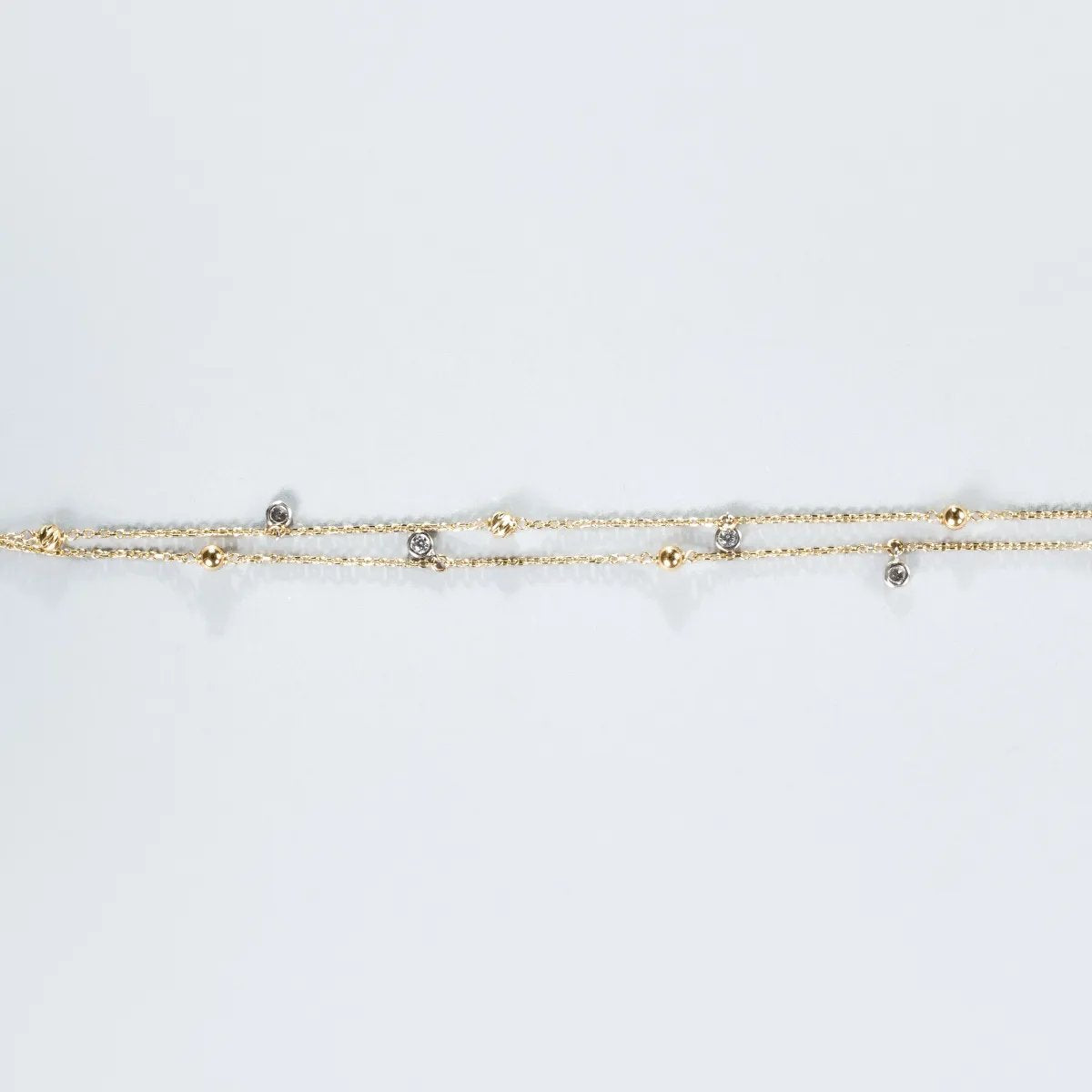 Yellow and white gold bracelet with zirconia