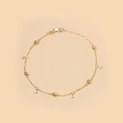 Yellow gold bracelet with spheres and cubic zirconia