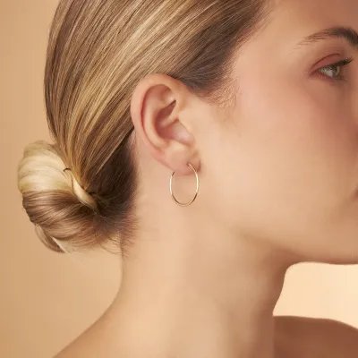 Yellow gold flex tube earrings 25 mm