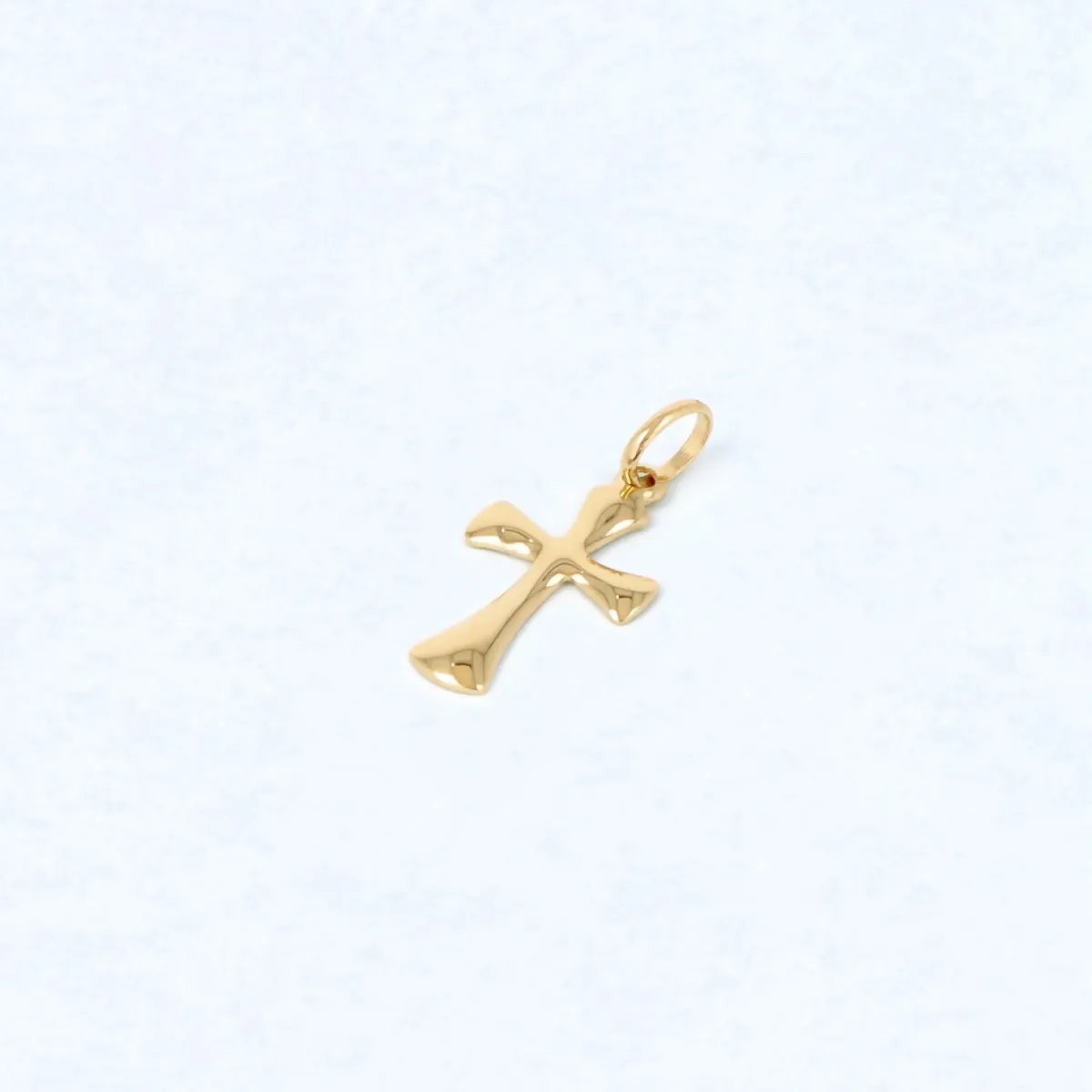 Slightly curved yellow gold cross