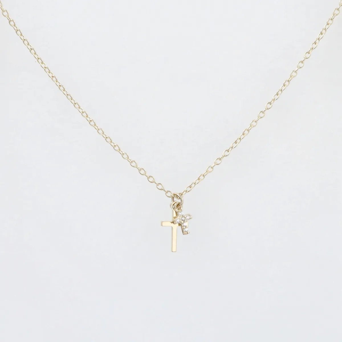 Yellow gold necklace with smooth cross and zircon cross