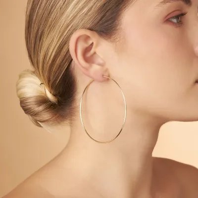 Yellow gold flex tube earrings 70 mm