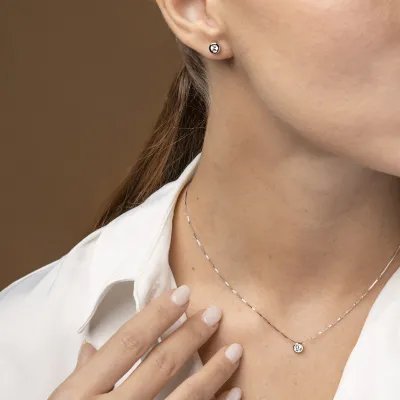 White gold solitare set with cubic zirconia: necklace and earrings