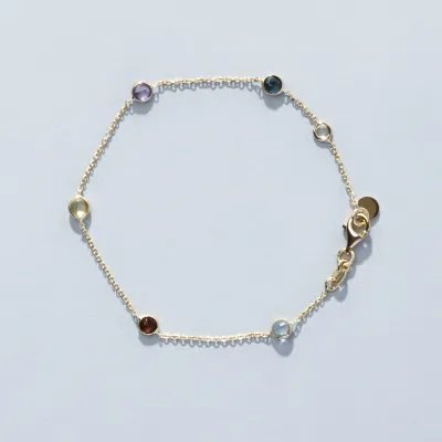 Yellow gold bracelet with natural stones