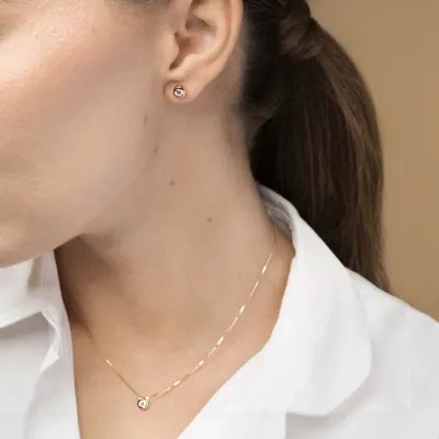 Yellow gold solitare set with cubic zirconia: necklace and earrings