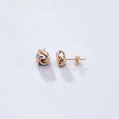 "Knot" earrings in yellow and white gold