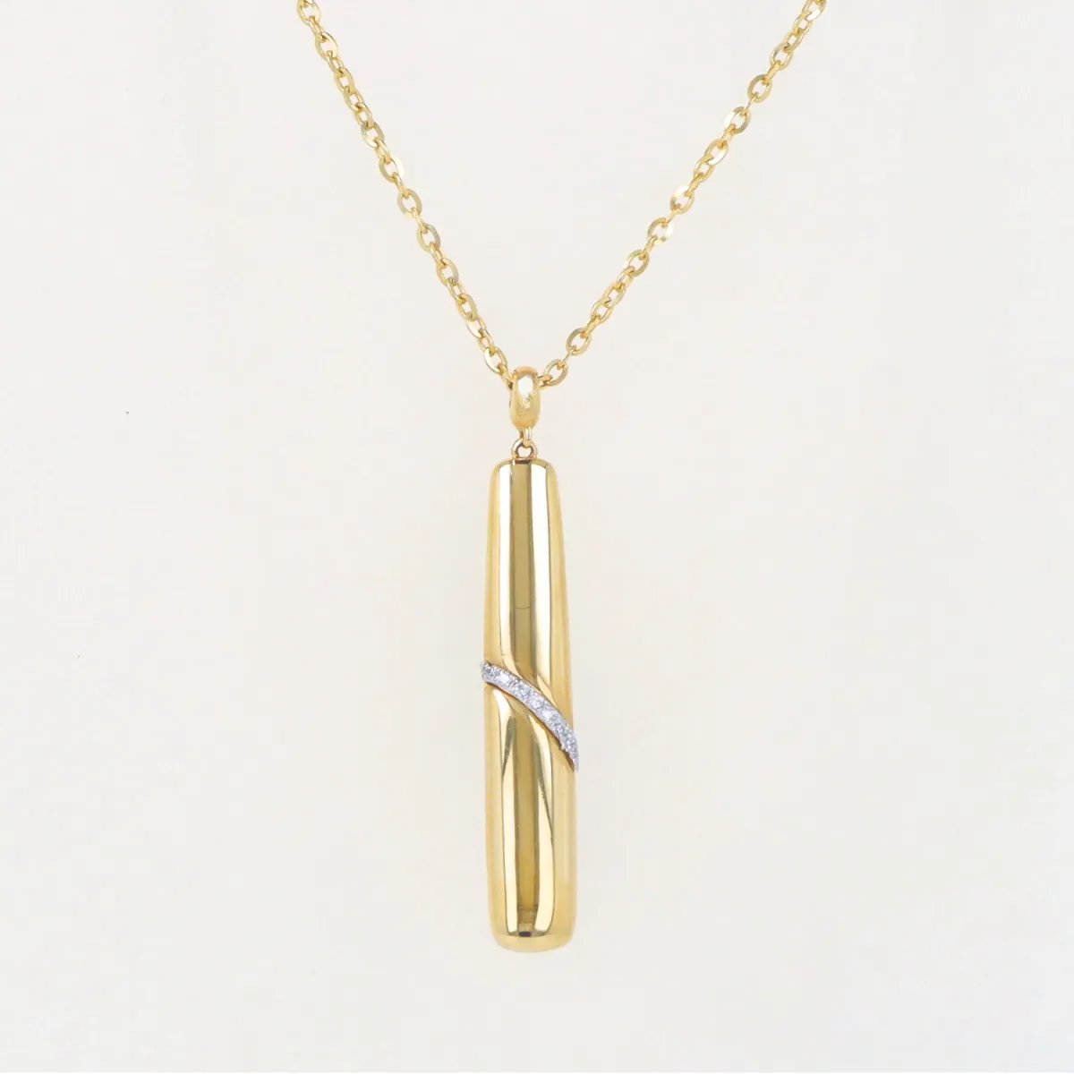 Yellow gold necklace with rectangular pendant with diagonal zirconia band