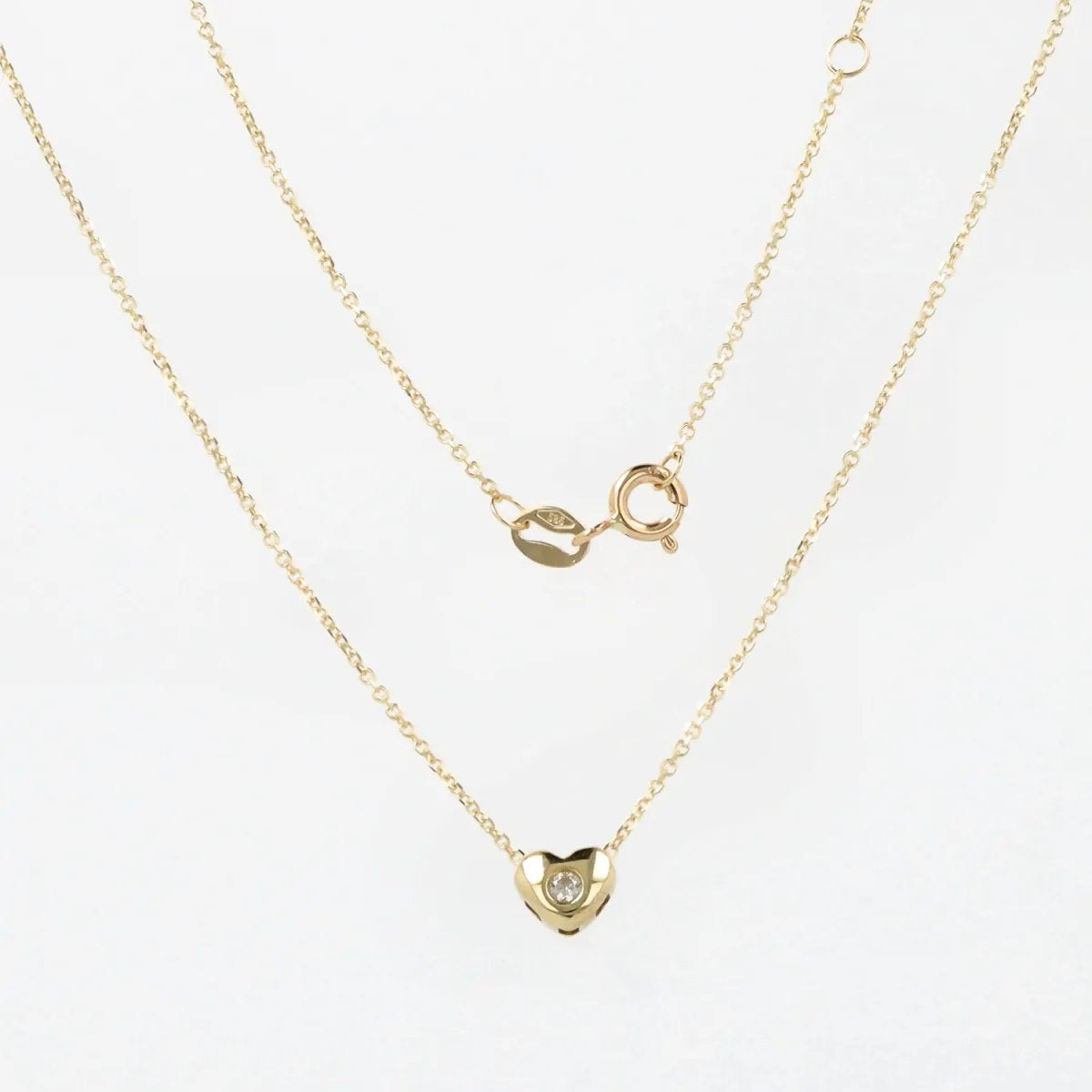 Lightweight yellow gold necklace with heart and zirconia