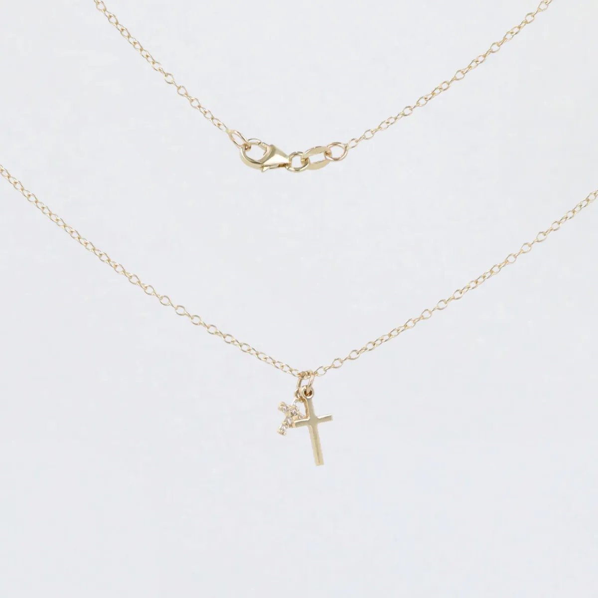 Yellow gold necklace with smooth cross and zircon cross