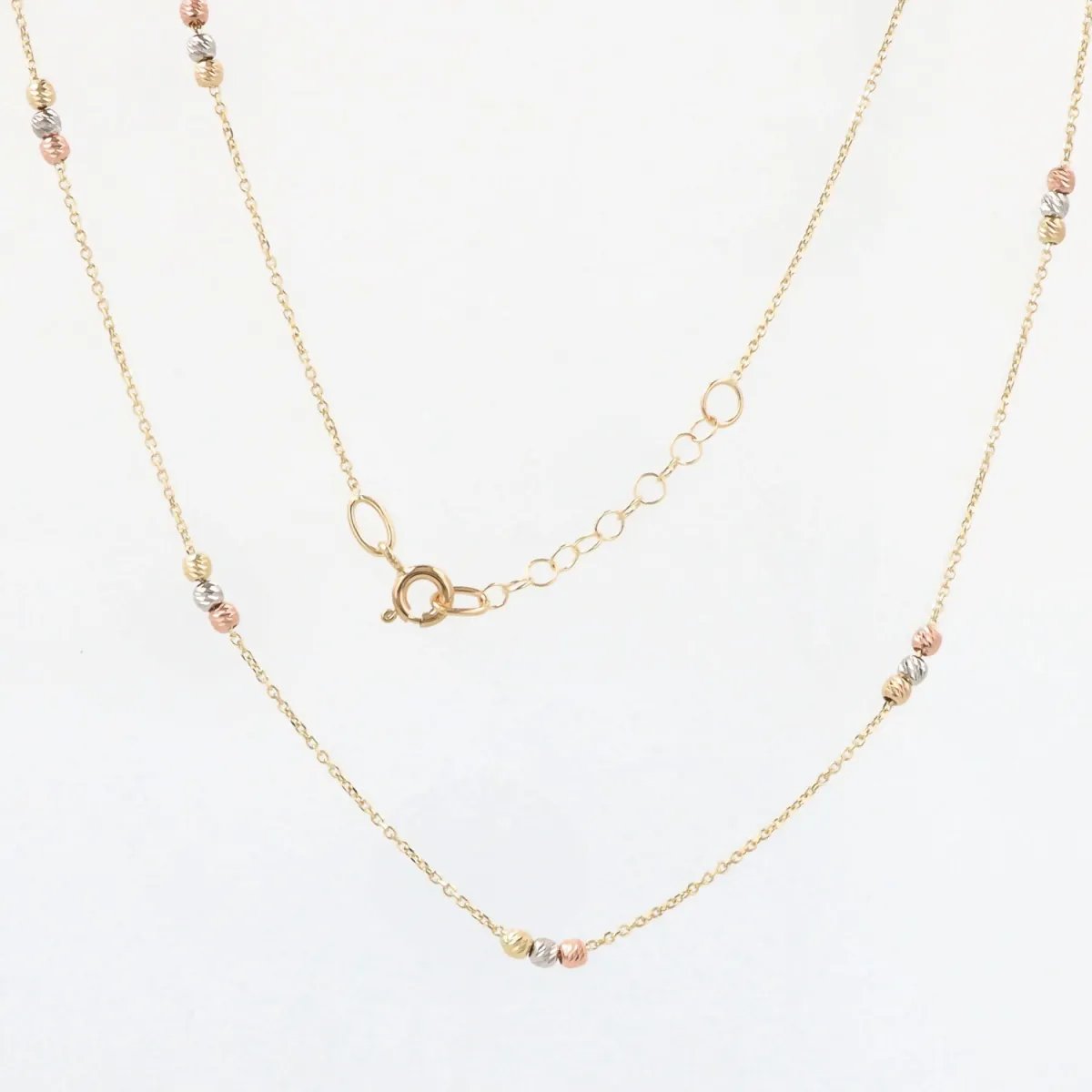 Lightweight necklace in white, yellow and rose gold with diamond-cut balls