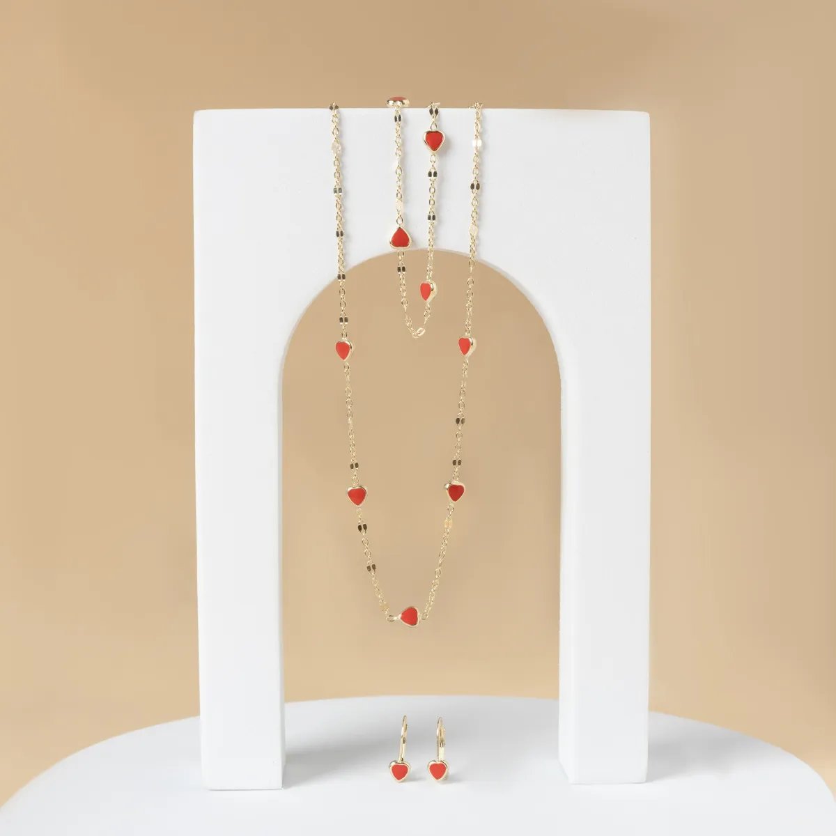 Yellow gold children's set with red enamelled hearts
