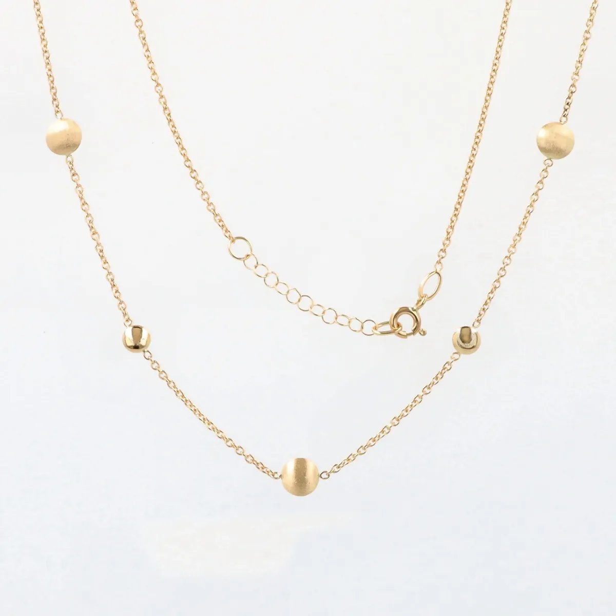 Yellow gold necklace with polished and satin-finished round elements