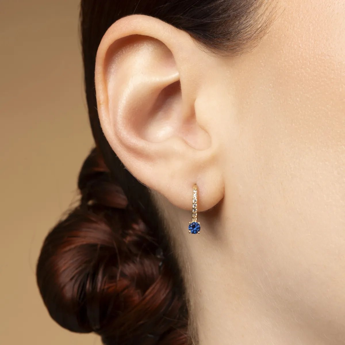 Yellow gold monachella earrings with white and blue cubic zirconia