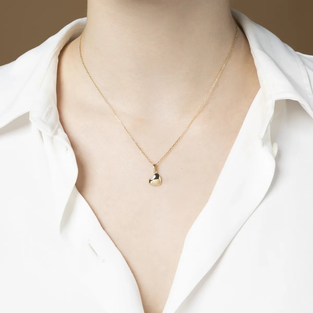 Yellow gold heart-shaped pendant with cubic zirconia