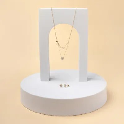 Set (necklace + earrings) in yellow gold with cubic zirconia