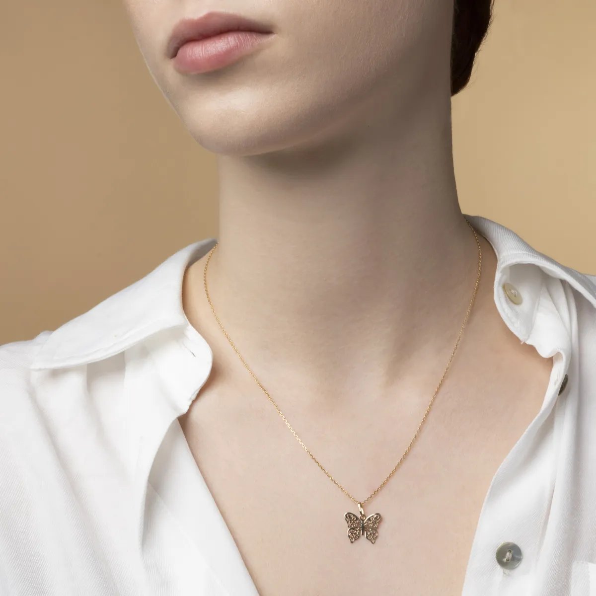 Yellow gold butterfly-shaped pendant