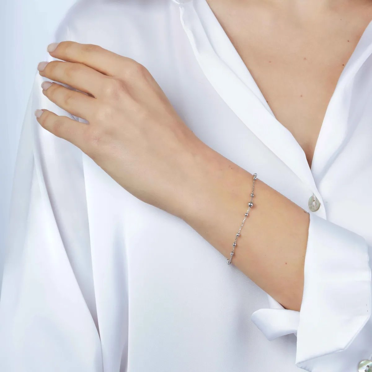 Light white gold bracelet with balls