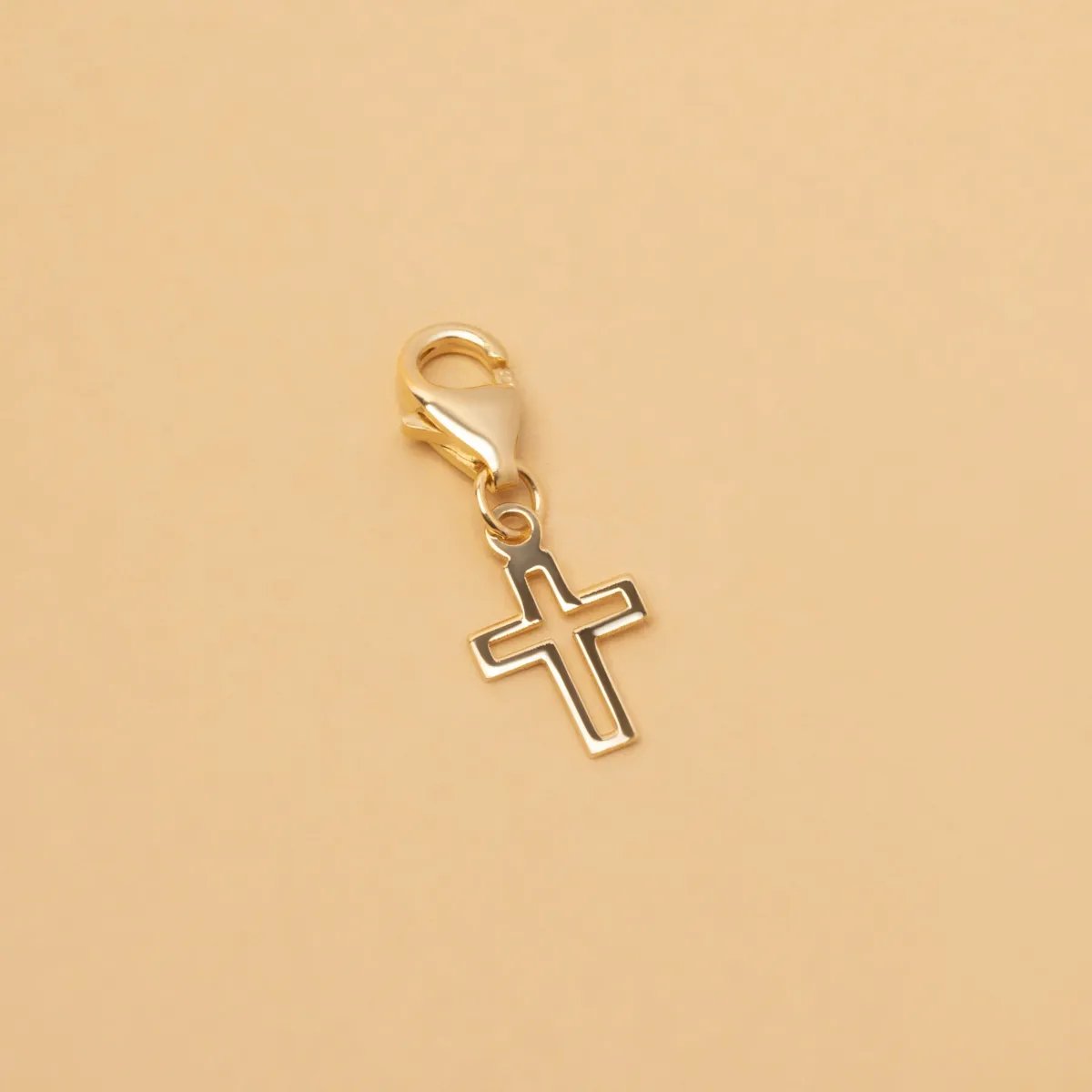Yellow gold cross-shaped charm pendant